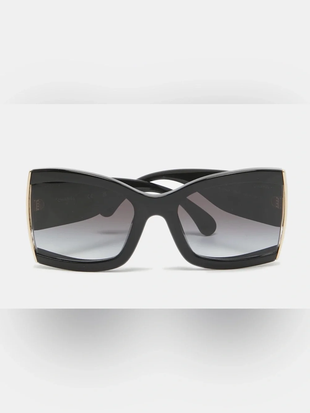 CHANEL Black Cat-Eye Sunglasses with Gold Accent and Gradient Gray Lenses